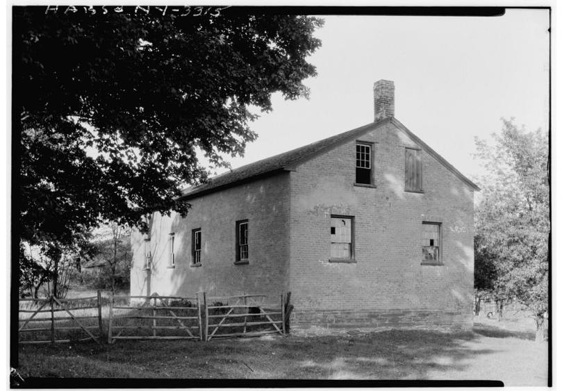 Figure 3. The school house at the Watervliet Shaker community in Colonie, New York. The school closed after 1926. Photo from the Library of Congress. [Historical American Buildings Survey, “Shaker Schoolhouse, Watervliet Shaker Road, Colonie Township, Watervliet, Albany County, NY”, after 1933, Photograph, Washington D.C., Library of Congress, Prints and Photographs Division].